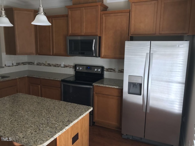 115 Ballyliffen Ln, Cary, NC 27519 - kitchen featuring appliances with stainless steel finishes, decorative backsplash, light stone counters, decorative light fixtures, and dark wood-type flooring