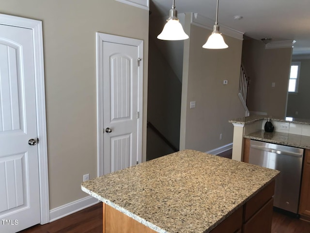 115 Ballyliffen Ln, Cary, NC 27519 - kitchen featuring stainless steel dishwasher, crown molding, a kitchen island, dark wood-style flooring, and decorative light fixtures