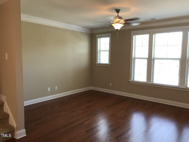 115 Ballyliffen Ln, Cary, NC 27519 - spare room with dark wood-style floors, ceiling fan, ornamental molding, stairs, and baseboards
