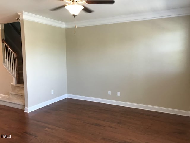 115 Ballyliffen Ln, Cary, NC 27519 - spare room featuring dark wood-type flooring, stairway, baseboards, a ceiling fan, and ornamental molding