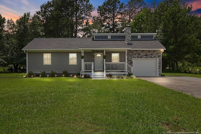 9872 NC-72 Hwy E, Lumberton, NC 28358 - view of front of house with covered porch, driveway, a front lawn, and a chimney