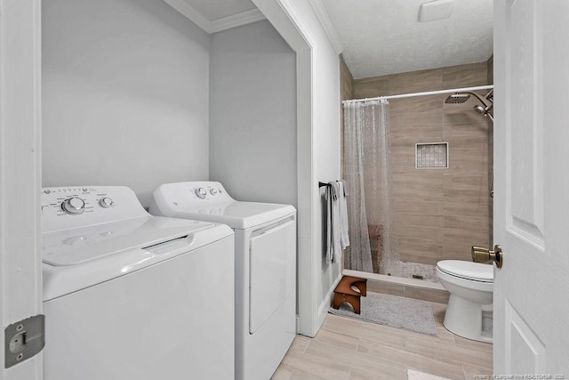 9872 NC-72 Hwy E, Lumberton, NC 28358 - laundry area featuring washing machine and clothes dryer and ornamental molding