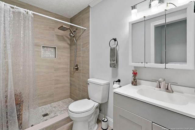 9872 NC-72 Hwy E, Lumberton, NC 28358 - full bathroom featuring toilet, vanity, a tile shower, and a textured ceiling