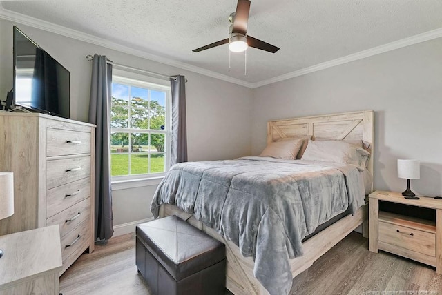 9872 NC-72 Hwy E, Lumberton, NC 28358 - bedroom with light wood finished floors, crown molding, ceiling fan, and baseboards