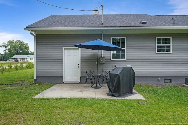 9872 NC-72 Hwy E, Lumberton, NC 28358 - back of house featuring a lawn, a patio area, roof with shingles, and a chimney