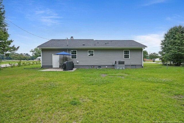 9872 NC-72 Hwy E, Lumberton, NC 28358 - rear view of property featuring a yard and central air condition unit