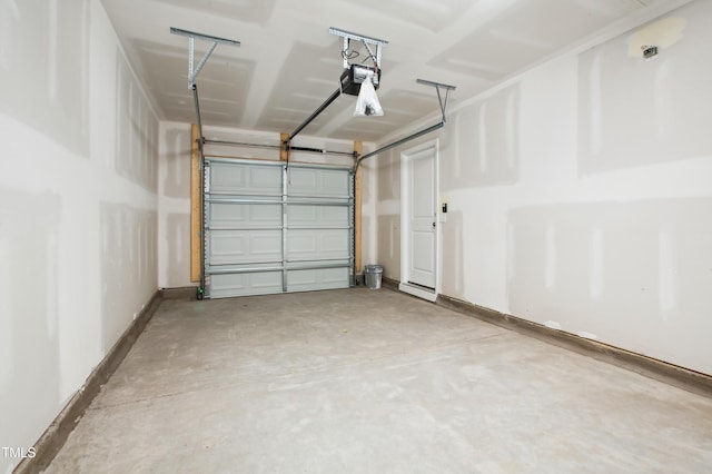 744 Parc Townes Dr Unit 34, Wendell, NC 27591 - garage featuring a garage door opener and baseboards