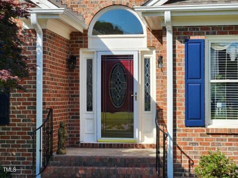 3409 Bennyfield Ct, Fuquay Varina, NC 27526 - property entrance featuring brick siding