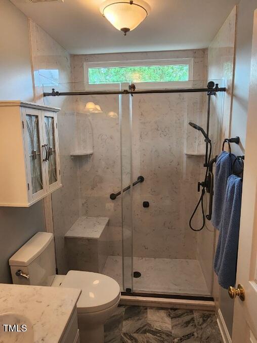 3409 Bennyfield Ct, Fuquay Varina, NC 27526 - bathroom featuring vanity, a shower stall, and marble finish floors