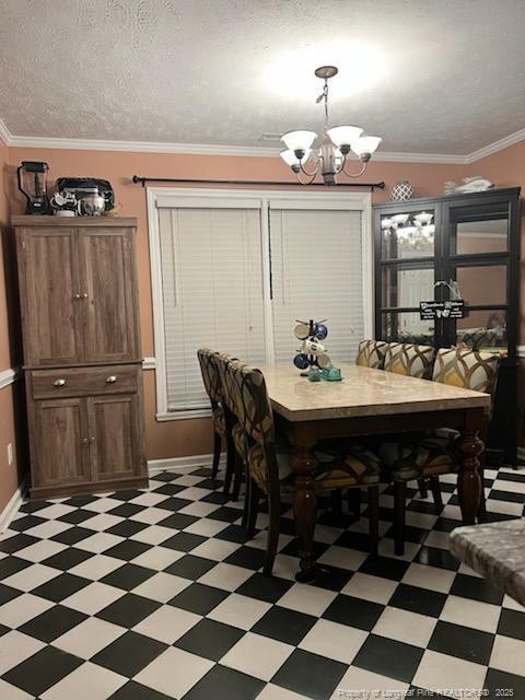 707 Connaly Dr, Hope Mills, NC 28348 - dining area with light flooring, a chandelier, baseboards, and crown molding