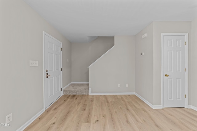 5012 Silverdene St, Raleigh, NC 27616 - entrance foyer featuring light wood-type flooring, baseboards, and stairs