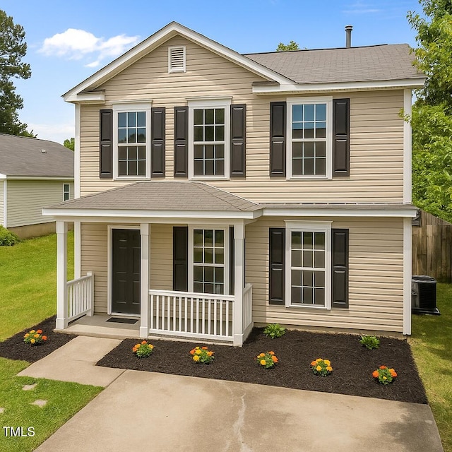 5012 Silverdene St, Raleigh, NC 27616 - traditional home with covered porch, a front yard, and roof with shingles