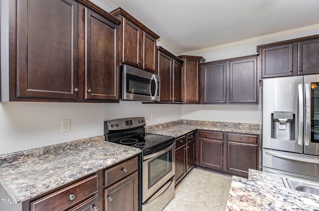 235 Camden Place St, Princeton, NC 27569 - kitchen with stainless steel appliances, ornamental molding, dark brown cabinetry, and light stone counters