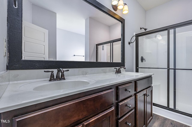235 Camden Place St, Princeton, NC 27569 - bathroom featuring double vanity, a shower stall, and wood finished floors