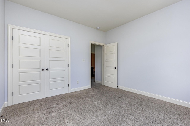 235 Camden Place St, Princeton, NC 27569 - unfurnished bedroom featuring carpet flooring, a closet, and baseboards