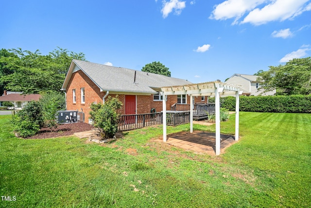 5 Windsor Pl, Mebane, NC 27302 - rear view of property featuring a pergola, brick siding, a yard, a patio area, and a shingled roof