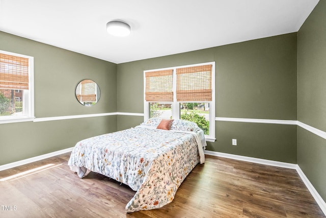 5 Windsor Pl, Mebane, NC 27302 - bedroom featuring multiple windows, wood finished floors, and baseboards