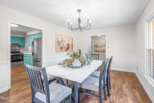 5 Windsor Pl, Mebane, NC 27302 - dining room featuring a chandelier, a wainscoted wall, and dark wood-type flooring