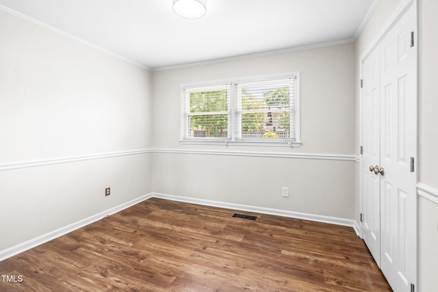 5 Windsor Pl, Mebane, NC 27302 - unfurnished bedroom featuring a closet, crown molding, wood finished floors, and baseboards
