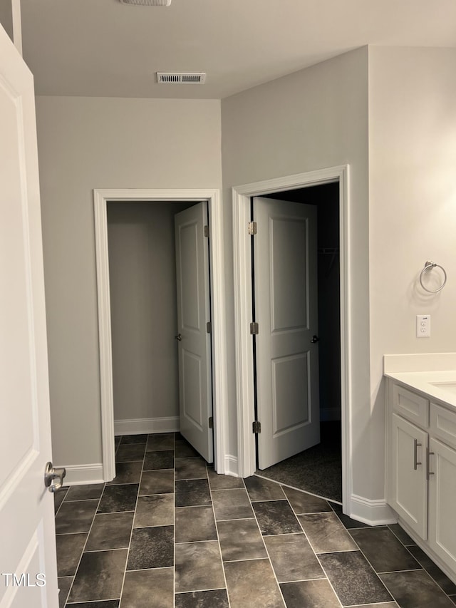 5046 Holly Hill Ct, Battleboro, NC 27809 - bathroom featuring vanity and baseboards
