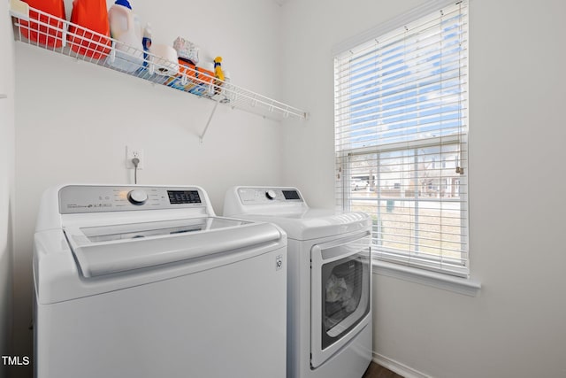 5332 Seaspray Ln, Raleigh, NC 27610 - washroom featuring independent washer and dryer, healthy amount of natural light, and baseboards
