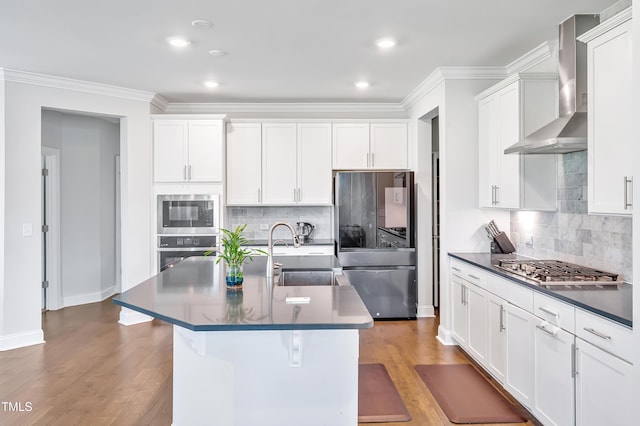 121 Canyon Gap Way, Raleigh, NC 27610 - kitchen with stainless steel appliances, wall chimney exhaust hood, a sink, dark countertops, and backsplash