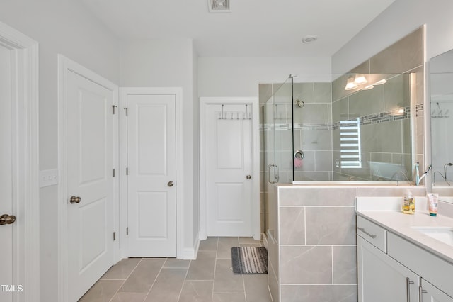 121 Canyon Gap Way, Raleigh, NC 27610 - bathroom with tile patterned floors, vanity, and a stall shower