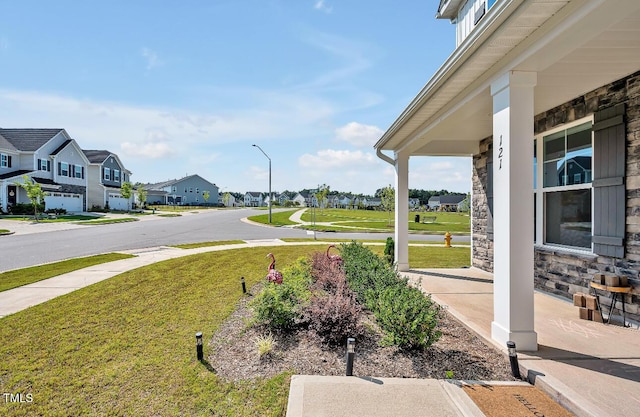 121 Canyon Gap Way, Raleigh, NC 27610 - view of green lawn featuring a residential view and covered porch