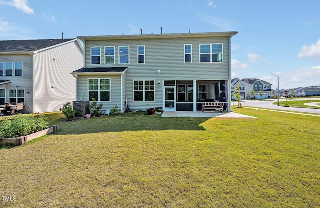 121 Canyon Gap Way, Raleigh, NC 27610 - back of property with a sunroom, a yard, a patio, and a residential view