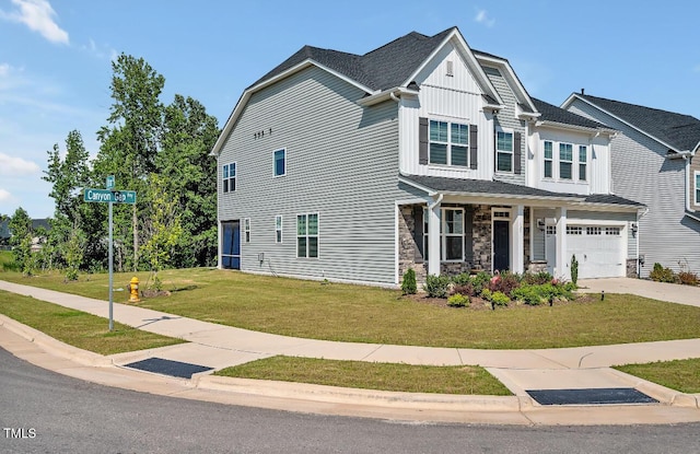 121 Canyon Gap Way, Raleigh, NC 27610 - craftsman inspired home featuring an attached garage, a front yard, driveway, a porch, and board and batten siding