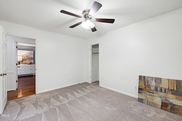 1416 Bramble Dr, Durham, NC 27712 - unfurnished bedroom with carpet flooring, baseboards, a closet, and ceiling fan