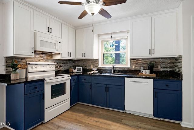 1416 Bramble Dr, Durham, NC 27712 - kitchen with white appliances, blue cabinets, a sink, decorative backsplash, and ceiling fan