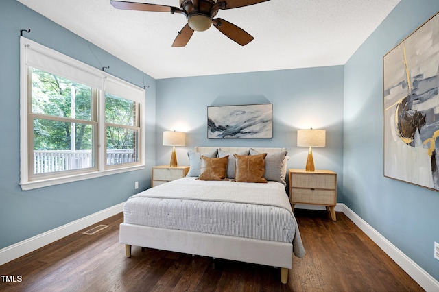 1416 Bramble Dr, Durham, NC 27712 - bedroom featuring multiple windows, wood finished floors, and baseboards