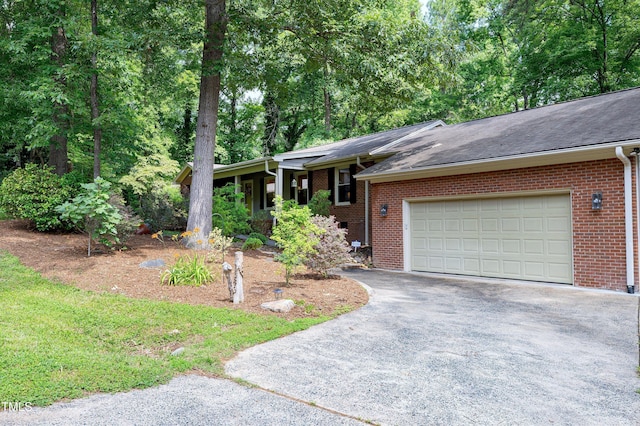 1416 Bramble Dr, Durham, NC 27712 - single story home featuring driveway, brick siding, an attached garage, and a shingled roof