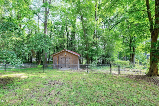 1416 Bramble Dr, Durham, NC 27712 - view of yard with a forest view and a gate