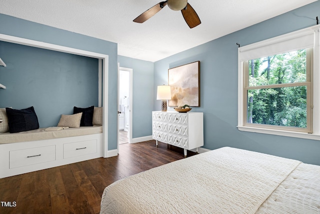 1416 Bramble Dr, Durham, NC 27712 - bedroom with dark wood-style flooring, baseboards, and a ceiling fan