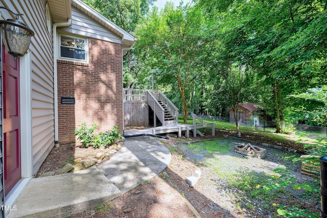 1416 Bramble Dr, Durham, NC 27712 - view of yard featuring a fire pit and stairs