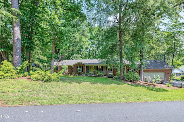 1416 Bramble Dr, Durham, NC 27712 - ranch-style home featuring a garage, a front lawn, asphalt driveway, and brick siding
