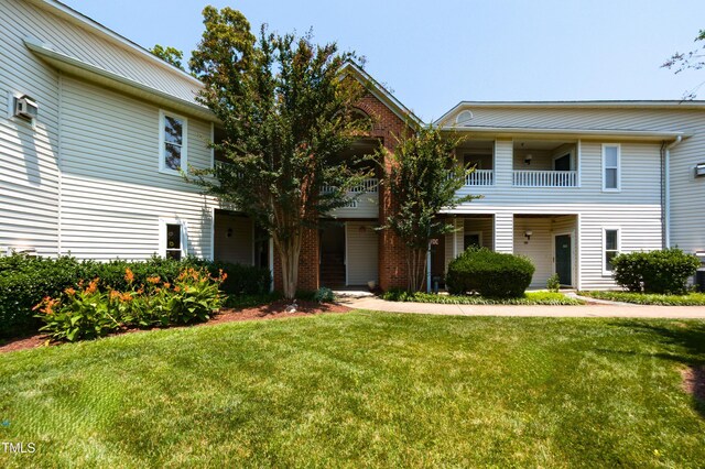 1911 Falls Landing Dr Unit 103, Raleigh, NC 27614 - townhome / multi-family property featuring a balcony, a front lawn, and cooling unit