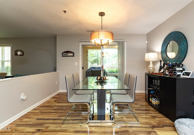 1911 Falls Landing Dr Unit 103, Raleigh, NC 27614 - dining space featuring wood finished floors and baseboards