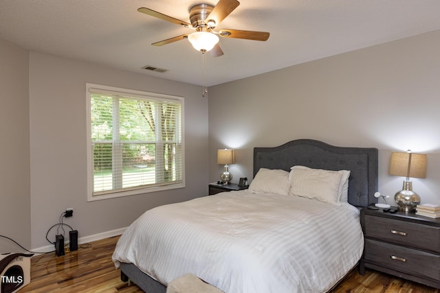 1911 Falls Landing Dr Unit 103, Raleigh, NC 27614 - bedroom with wood finished floors, baseboards, and a ceiling fan