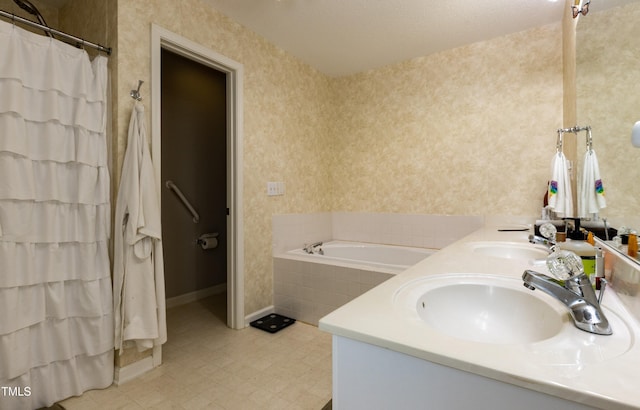 1911 Falls Landing Dr Unit 103, Raleigh, NC 27614 - bathroom featuring double vanity, a garden tub, wallpapered walls, baseboards, and a shower with curtain