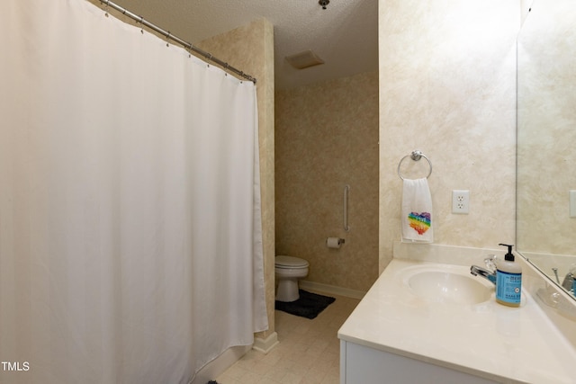 1911 Falls Landing Dr Unit 103, Raleigh, NC 27614 - full bath featuring vanity, toilet, curtained shower, tile patterned floors, and a textured ceiling