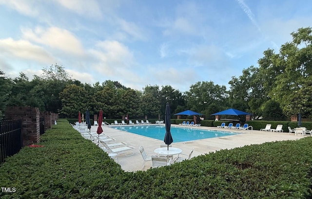 1911 Falls Landing Dr Unit 103, Raleigh, NC 27614 - community pool featuring a patio area and view of wooded area