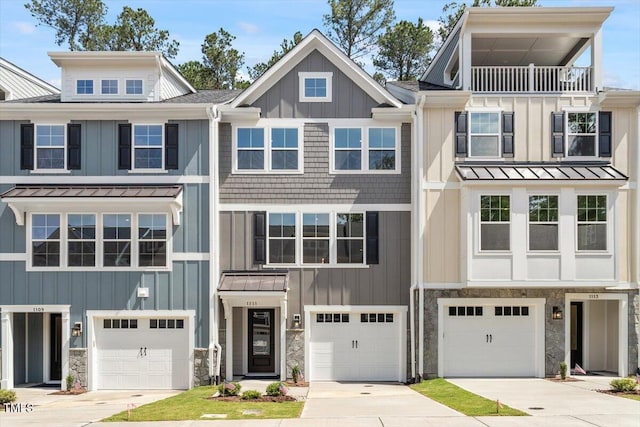509 Sherron Rd Unit 9, Durham, NC 27703 - townhome / multi-family property featuring a standing seam roof, stone siding, and driveway
