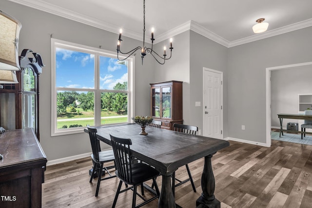 80 Shartree Farms Ln, Louisburg, NC 27549 - dining space featuring plenty of natural light, dark wood finished floors, ornamental molding, and a chandelier