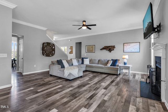 80 Shartree Farms Ln, Louisburg, NC 27549 - living area featuring healthy amount of natural light, dark wood-style floors, ceiling fan, ornamental molding, and a fireplace with flush hearth