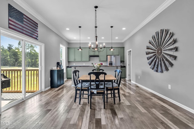 80 Shartree Farms Ln, Louisburg, NC 27549 - dining area with wood finished floors, recessed lighting, a chandelier, and crown molding