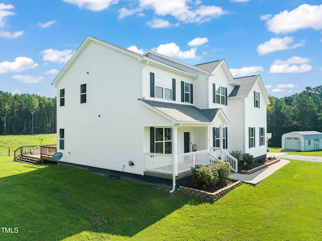 80 Shartree Farms Ln, Louisburg, NC 27549 - view of home's exterior featuring covered porch, an outbuilding, and a yard