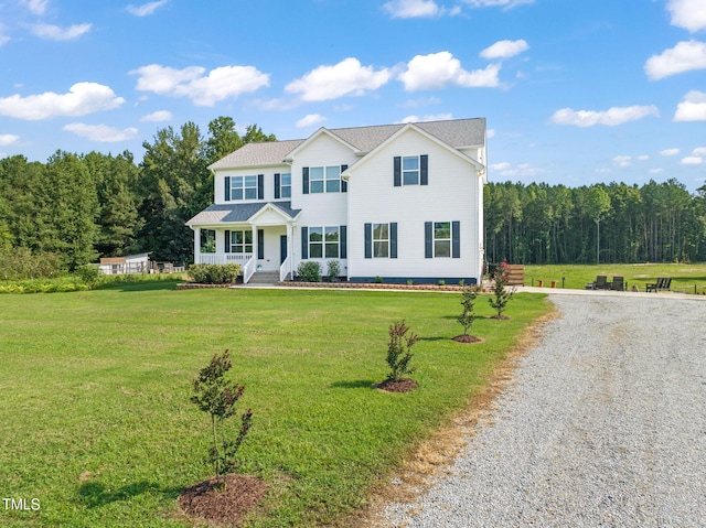 80 Shartree Farms Ln, Louisburg, NC 27549 - view of front of property featuring covered porch, a front lawn, driveway, and a wooded view